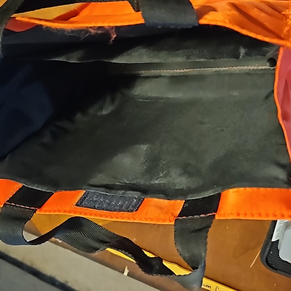 This is a red tote bag with handles.